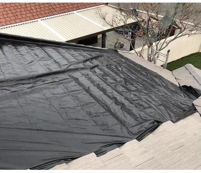 tarp on roof 