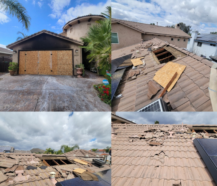 Bordered up garage with a hole in roof, from a fire.