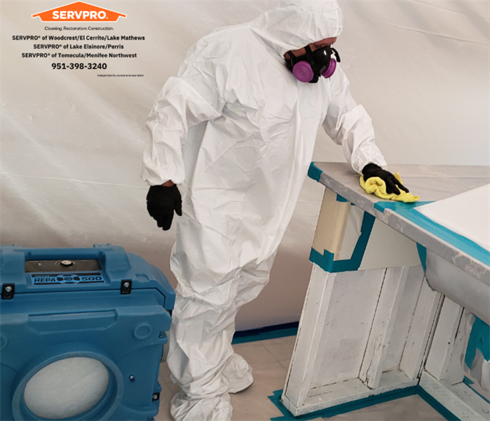 SERVPRO worker suited up for mold remediation.