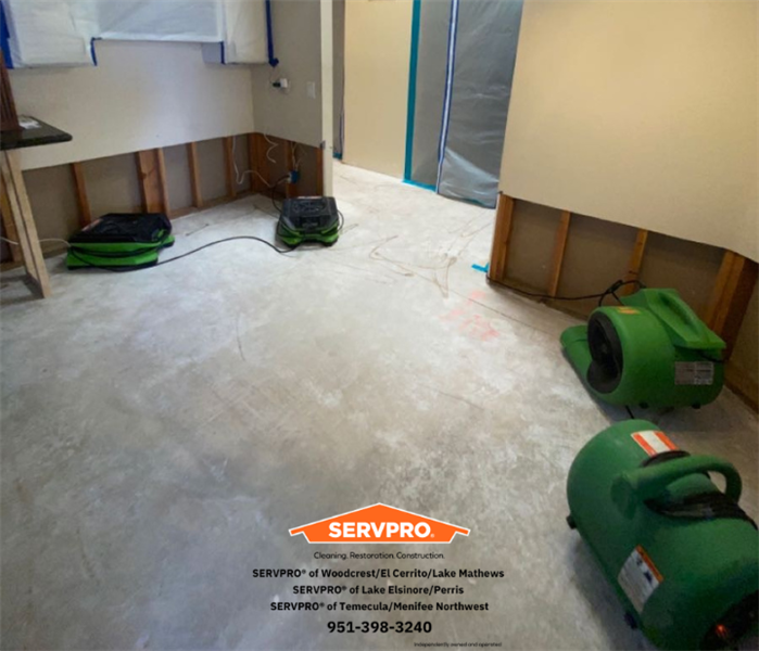 Ripped up floors, walls and containment with our air movers. 