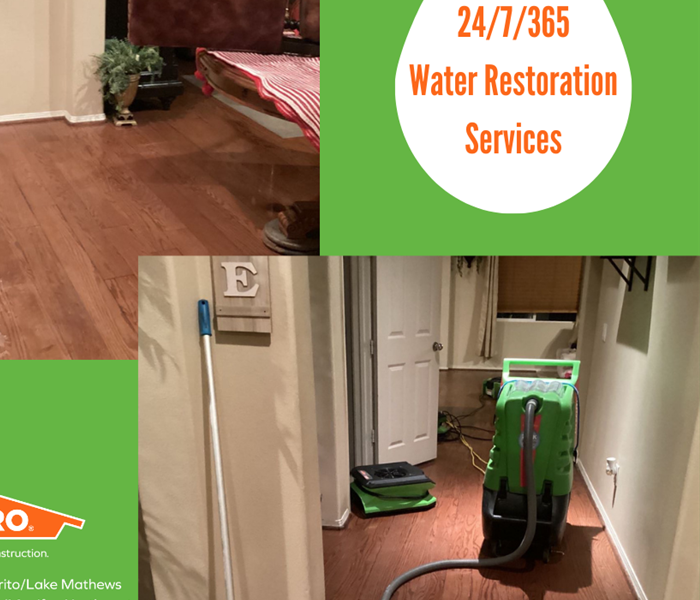 SERVPRO equipment inside a flooded home during night time